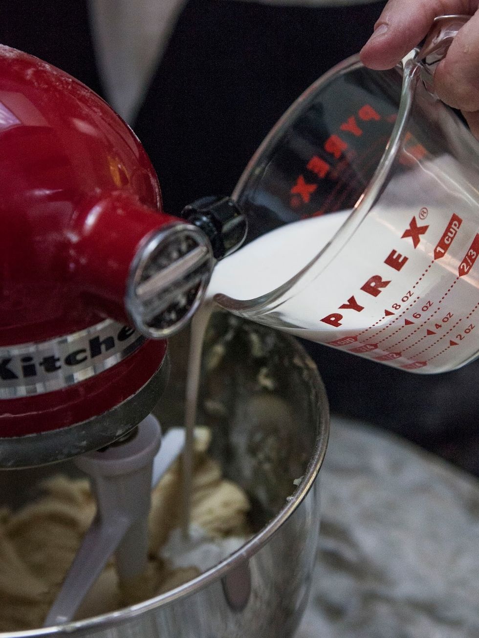 With the beater still on low, slowly drizzle in the Heavy Cream.