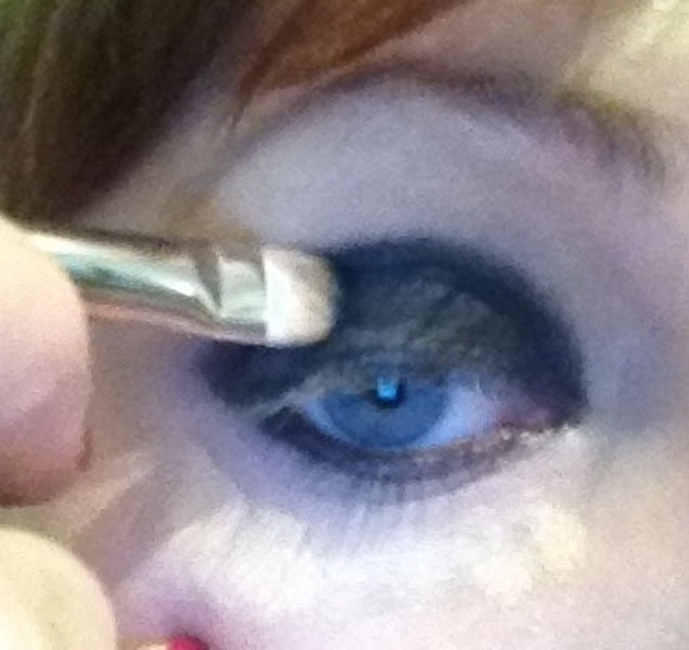 With the black from my Illamasqua palette I'm now adding the shadow to the roughly applied kohl. Under the eye I've added powder to catch the black fall out!!!