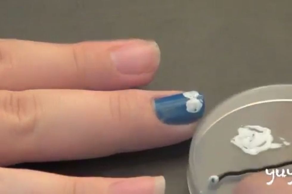 with the bobby pin take some white color and make two circles in the muddle at the top there where the eyes ...
