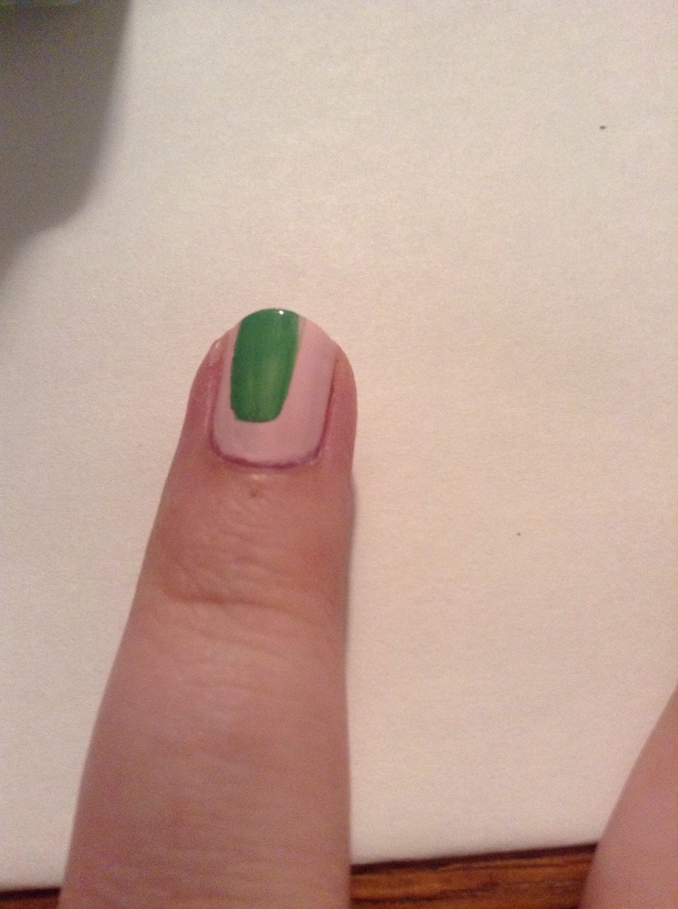 With the bottle brush, make sure you don't have too much polish on the brush, make the body of your dinosaur. Just a swipe of polish, however big you want your dinosaur.