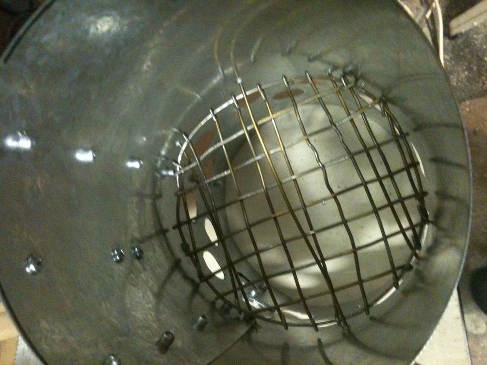 With the center hole stick hanger though over the screen and try to get into opposite hole. This wire holds the screen down and in place.