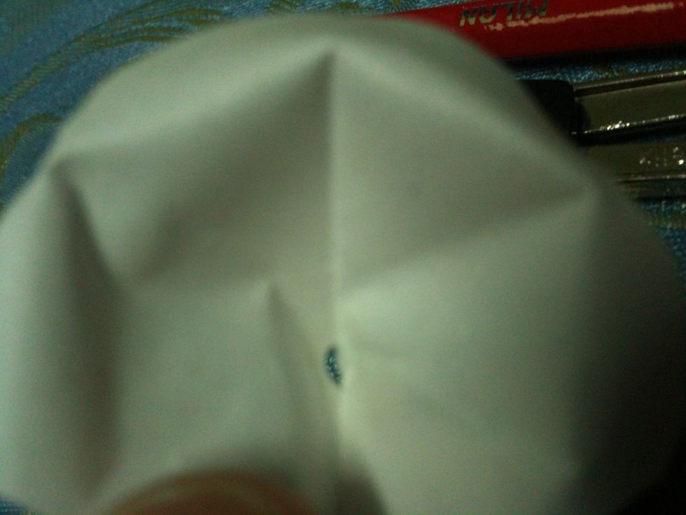 With the compass, poke holes in the center