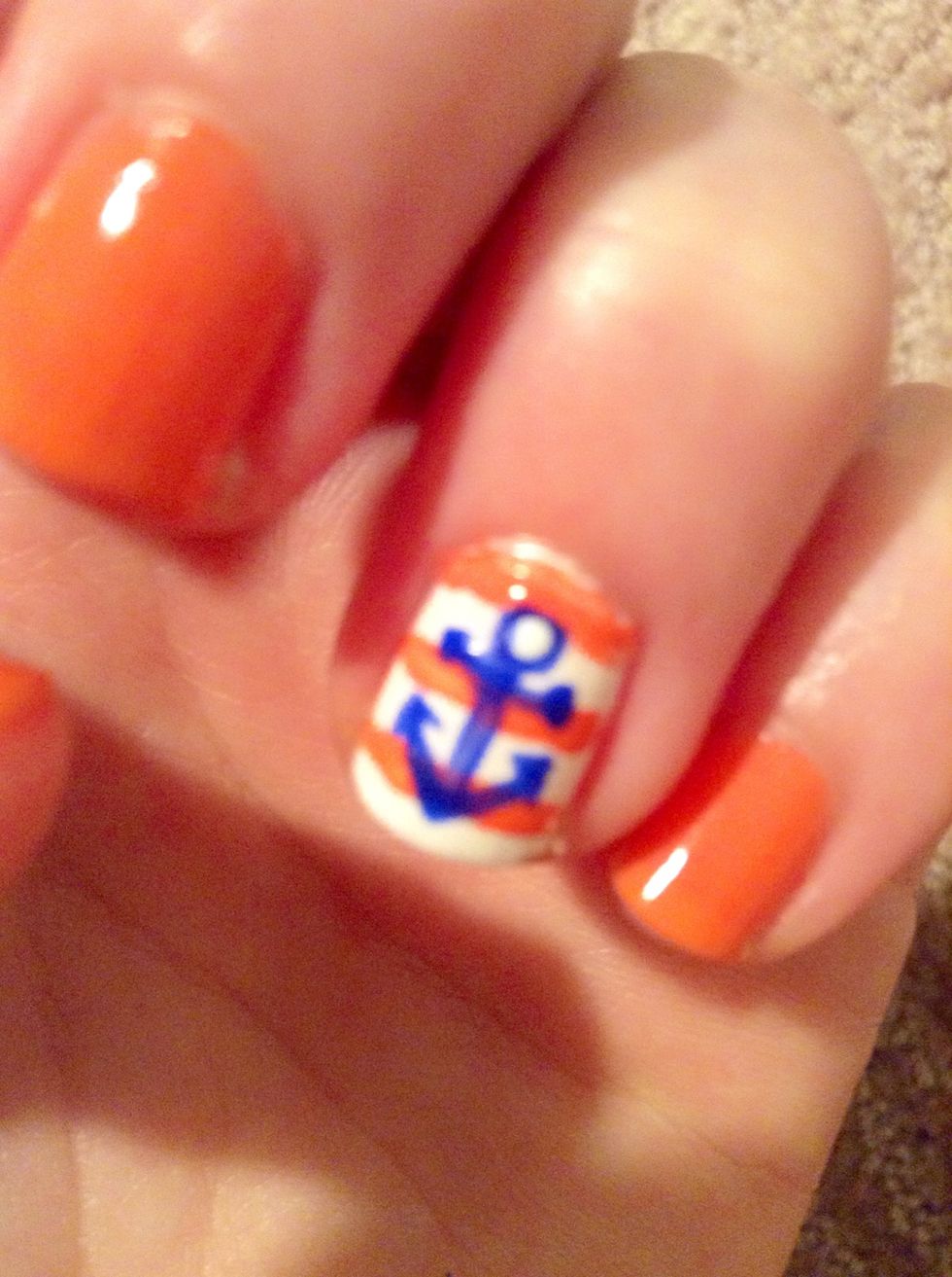 With the dotting tool, make two small dots at each end of the short horizontal line and one large dot at the top of the "t." Make a small white dot inside of the large blue dot.