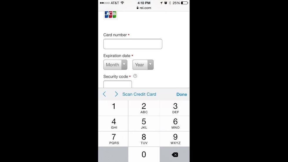 With the field selected you'll have an option to scan credit card. The camera will now allow you to capture an image that will not be saved or uploaded. It's used to recognize the digits on your card.