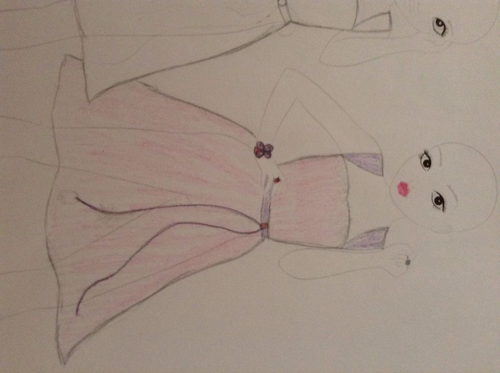 With the first one, use the purple and pink pencils. Just lightly colour in the different sections of the dress in block sections, pink for the dress and purple for the straps and belt.