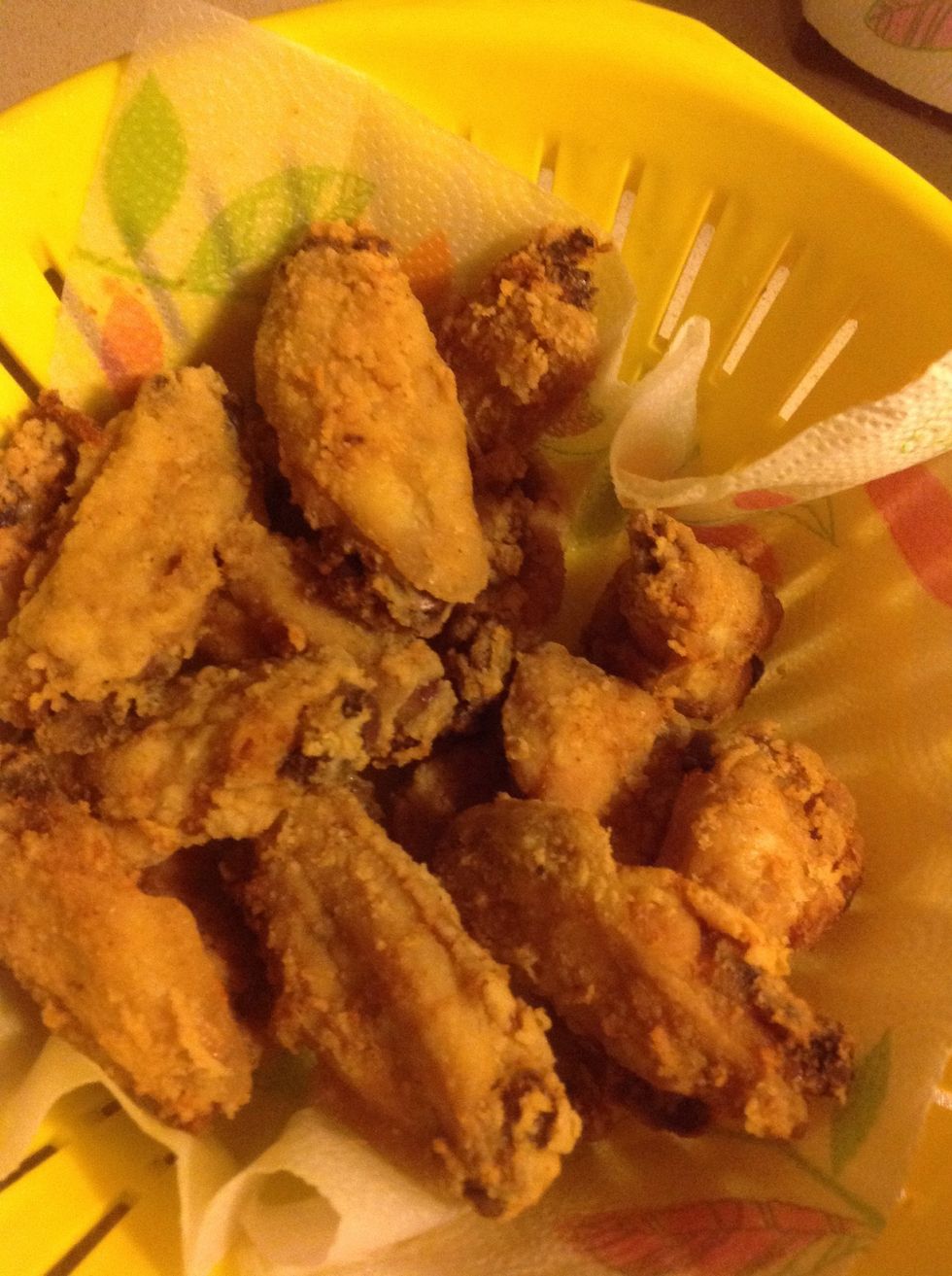 With the fork take the chicken out piece by piece and place it into the strainer