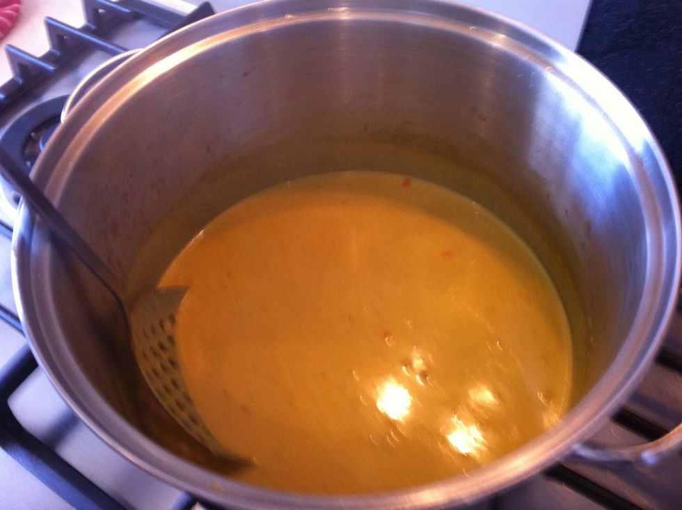 With the heat still on add the chicken stock and coconut cream. Simmer on low.