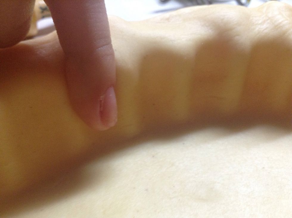 With the help of any finger gently press the dough against the mold.