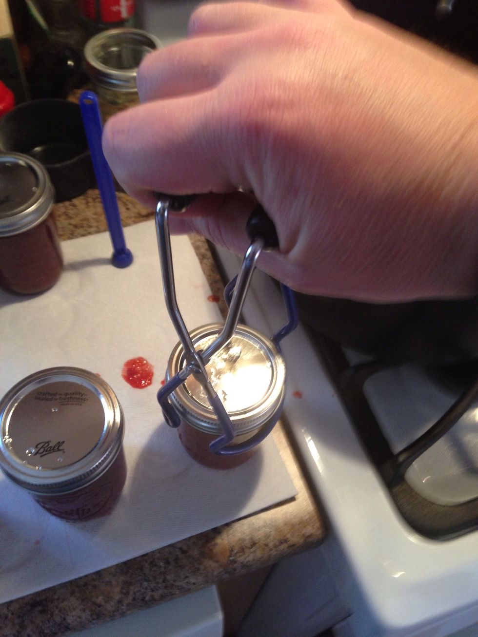 With the jar tongs place them back into the almost boiling water.