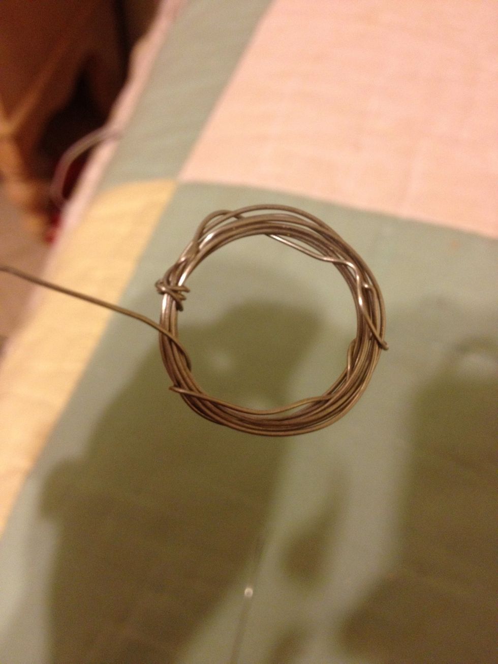 With the long wire, wrap it around the bunch so it won't awkwardly try to unshape itself. Reshape it circularly if it gets jagged