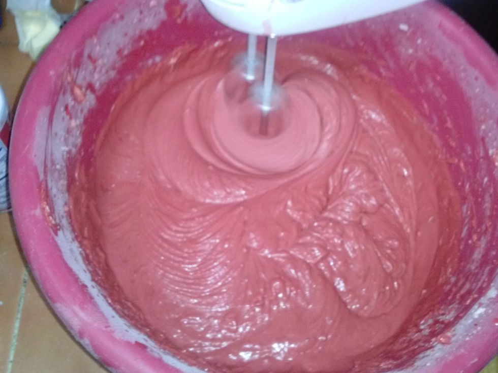 With the mixer, add the flour mixture and and milk to the butter mixture in three additions.You will then combine vinegar with the baking powder. Then let it fizz and quickly put into the cake batter.