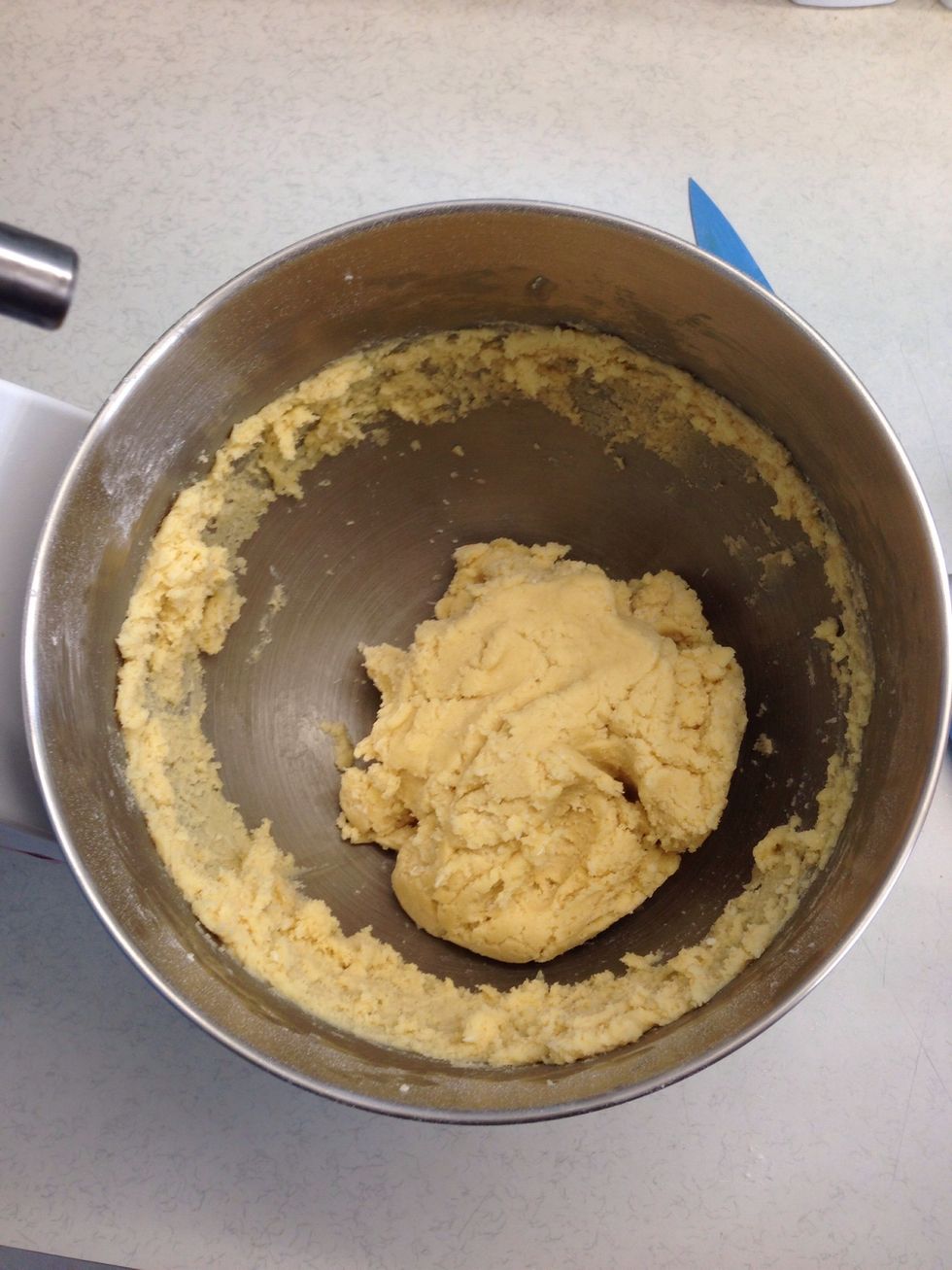 With the mixer on low, slowly add the flour and coconut until it forms a dough. You'll have to mix it with your hands at the end as it gets quite dry.