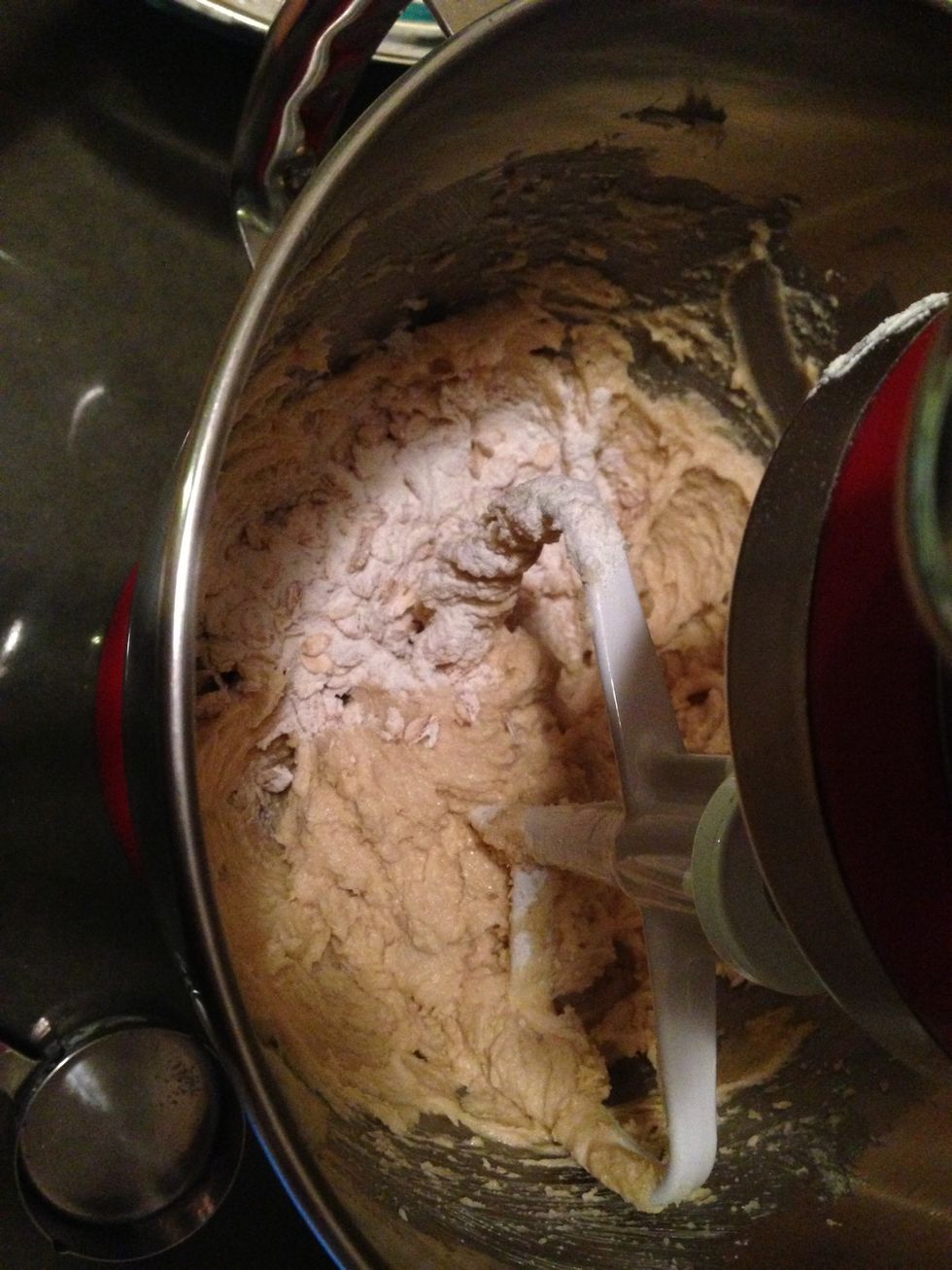 With the mixer on low speed, add the flour mixture in small portions until it's all mixed in.