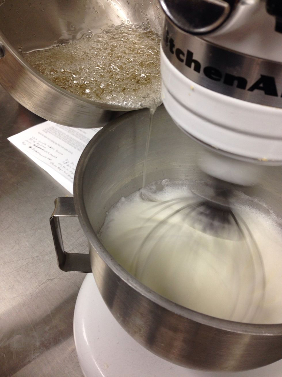 With the mixer running slowly add hot sugar mix by drizzling down side of the bowl. Do not add too quickly.