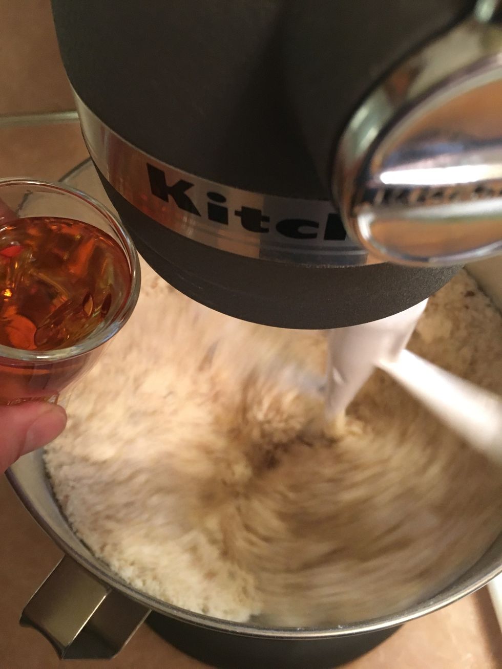 With the mixer running, slowly add the whisky.