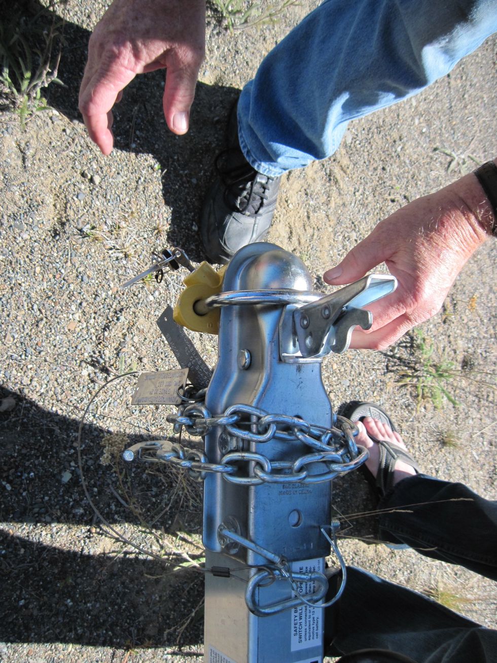 With the pin pulled and the lever up, you can remove the  hitch lock.