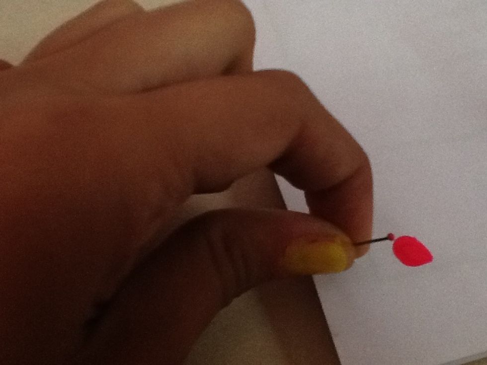 With the pin take some nailpaint on the flattened part.