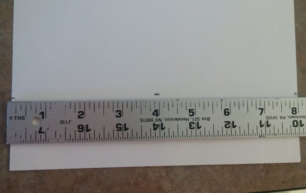 With the ruler still 2 inches up from the bottom of the paper straight across. Make a mark at 4 inches.
