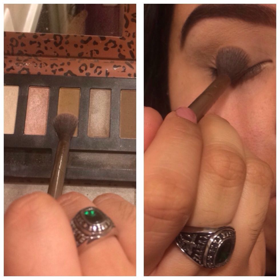 with the same blending brush, get a slightly warmer brown, and lightly blend this back and forth into your crease. Work in slow windshield wiper motions for a clean and buffed look.