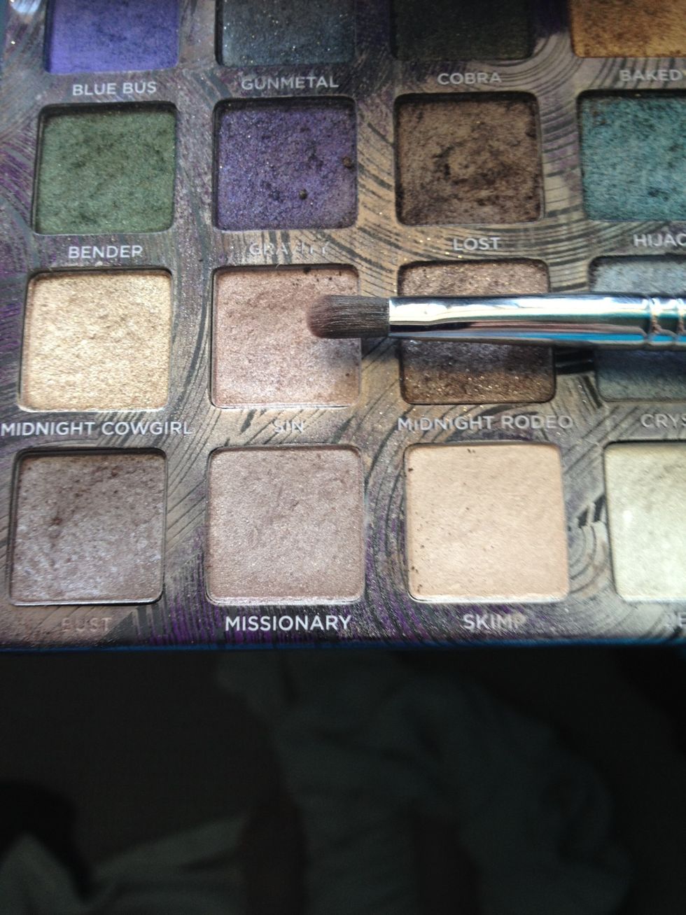 With the smaller brush use a lighter color for the inside of your eyelid