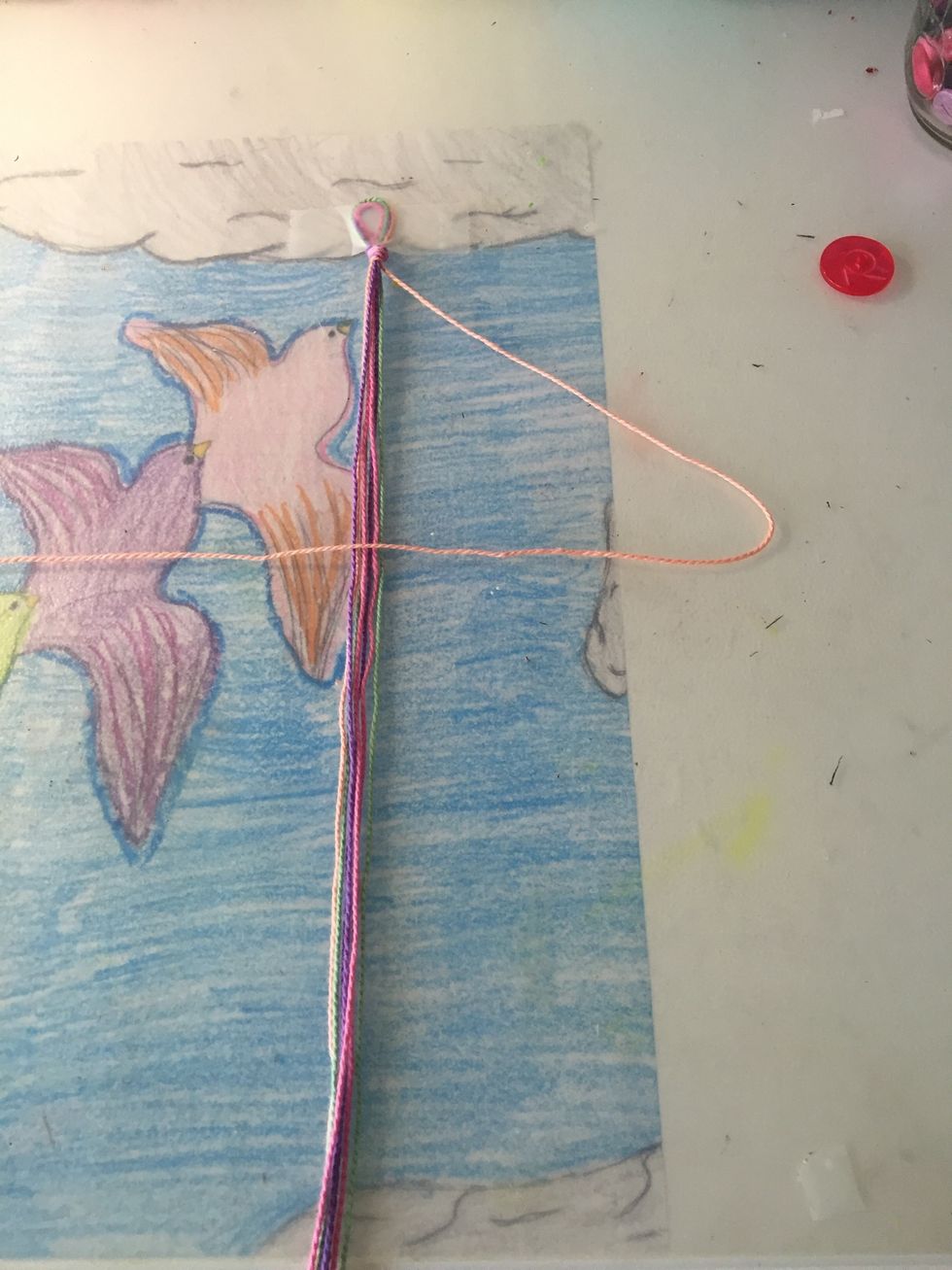 With the string you took out make a '4' shape like shown in the picture