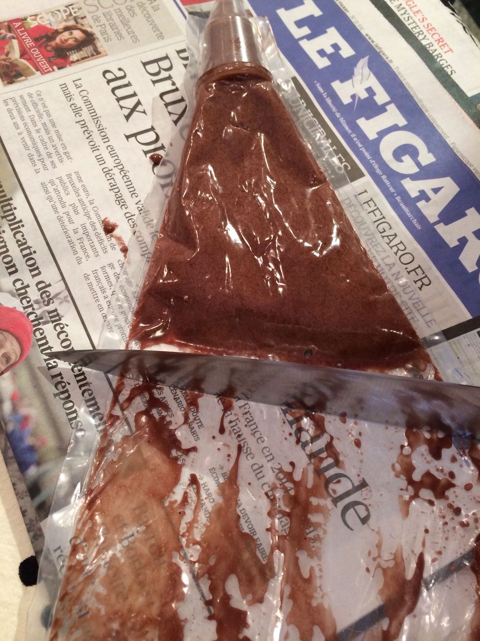 With the thick side of a knife. Once Piped, the raw macarons have to sit uncovered for at least 30 mins. In a humid climate, they would need to dry in the open for at least 1 hour.