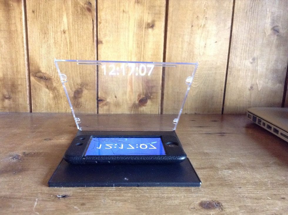 With the webpage open, turn your screen brightness all the way up and place it below the clear half of the cd case.