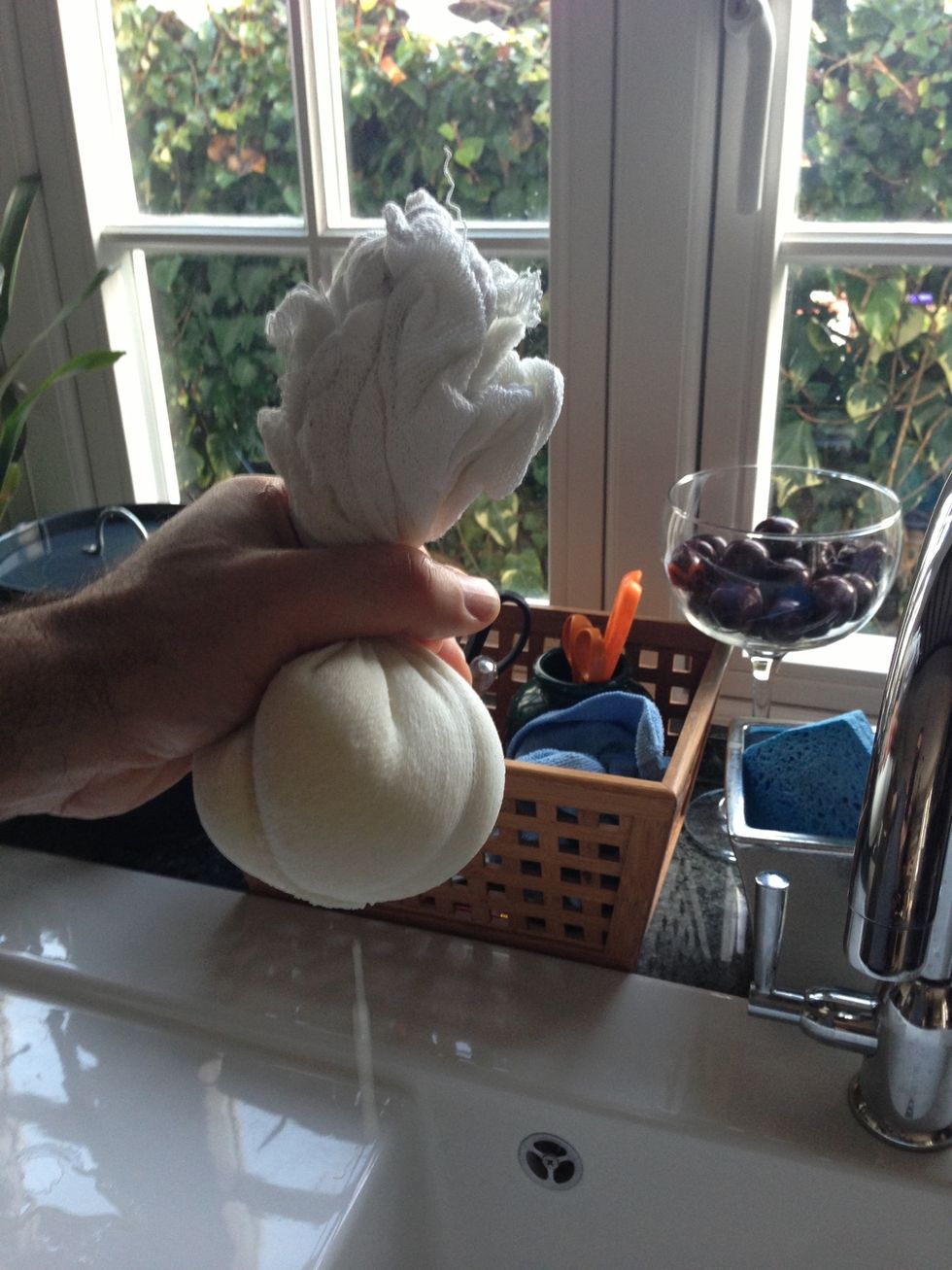 With twi hands twist top of the muslin increasing pressure slowly. Whey will drip and turn to a trickle. Stop when it dries up or cheese escapes.. You can skip this step if you want Labeneh softer.