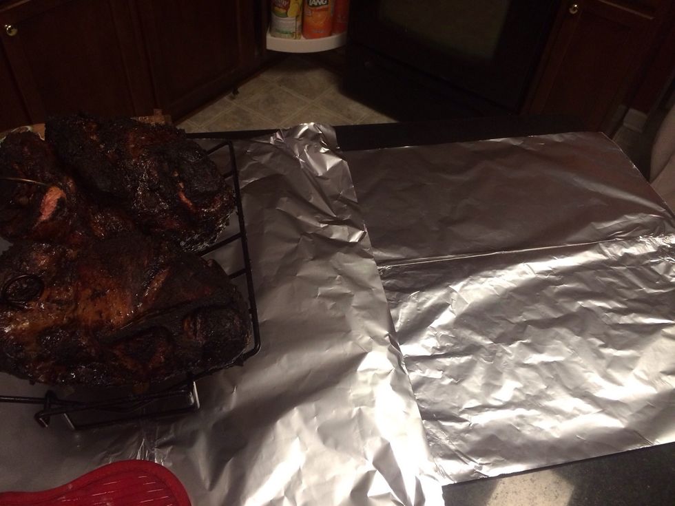With two large pieces of aluminum foil, fold them together to make one single piece. These will be used to wrap the butts for the final hour.