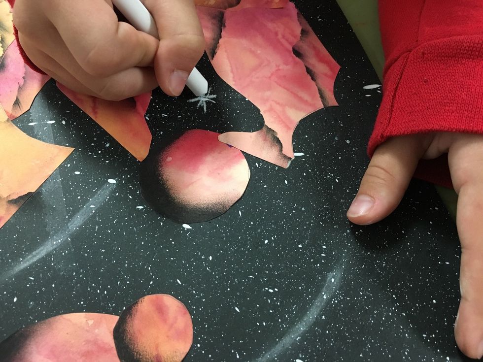 With white chalk add a few commets, shooting stars, and twinkling stars.