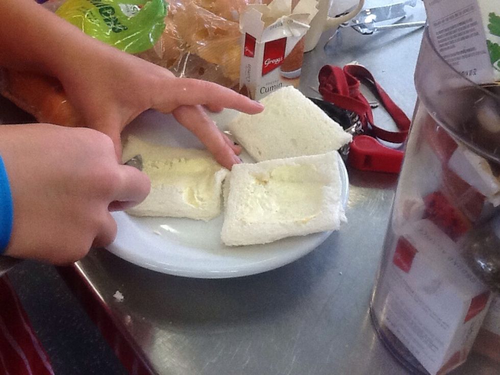 With your bread, cut of the crust and butter all over