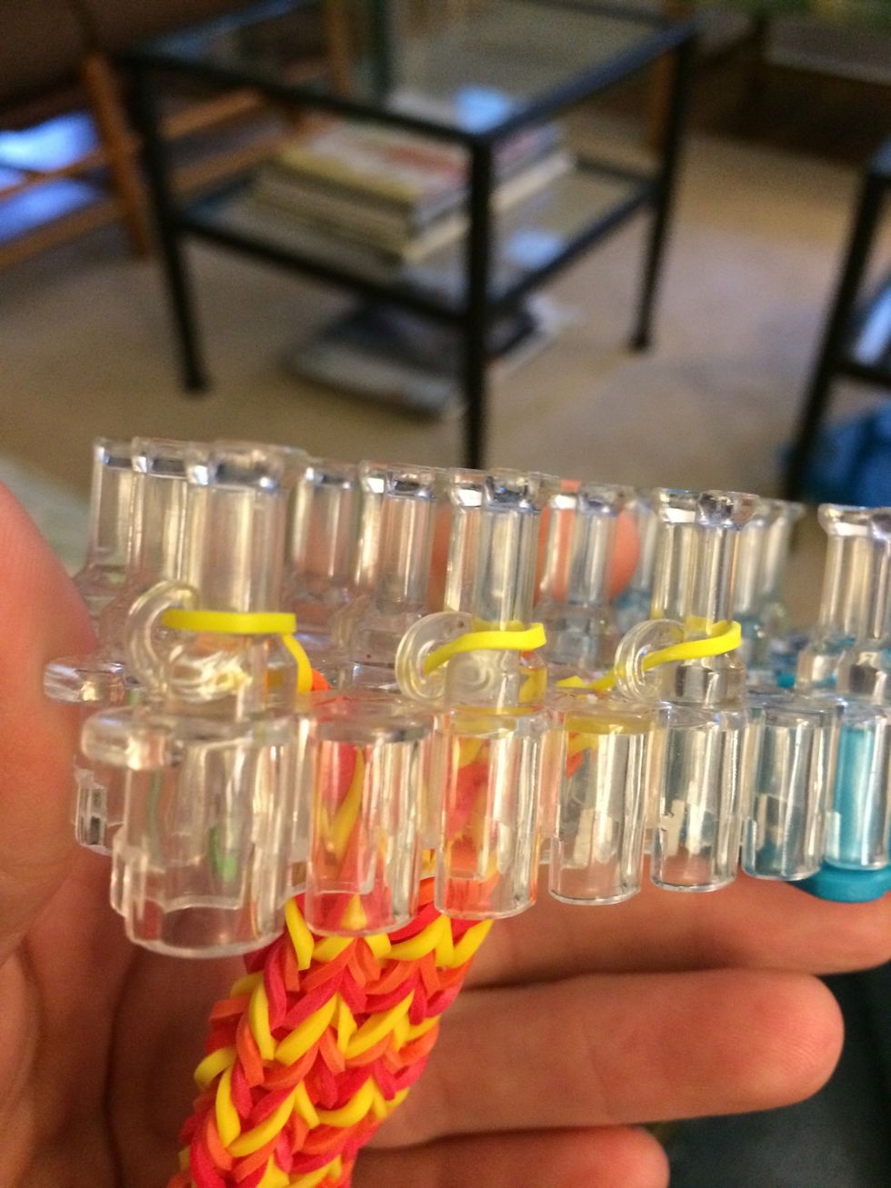 With your clips attached you can finally take your bracelet off the loom.