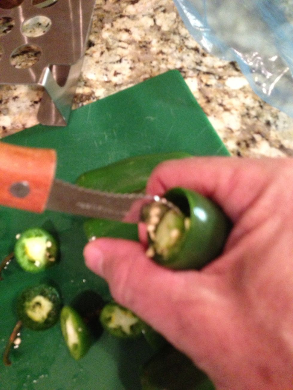 With your coring tool hollow out each pepper after cutting off the tops
