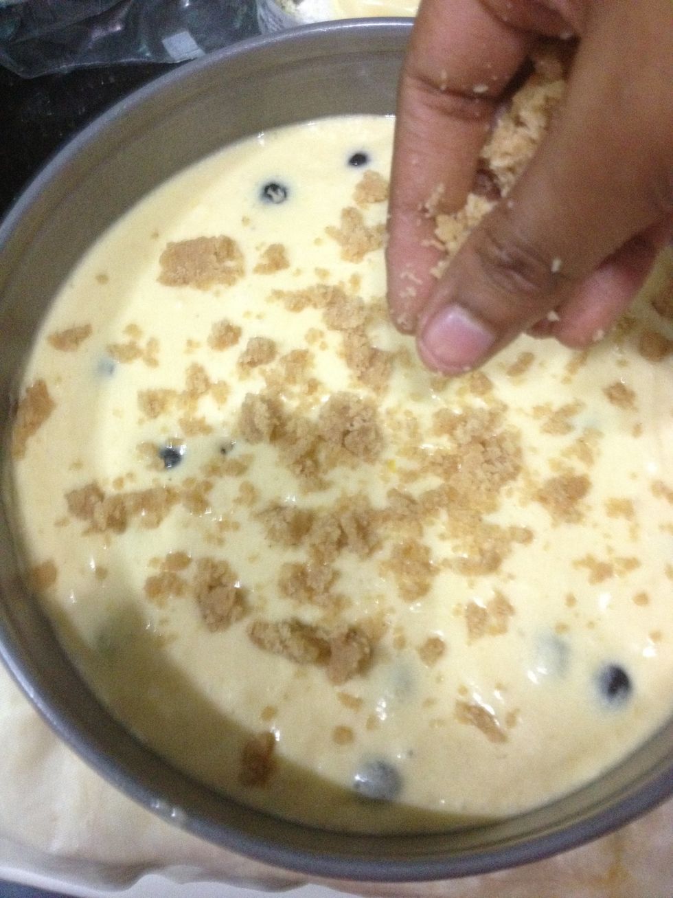 With your fingers, crumble the topping evenly over the batter.