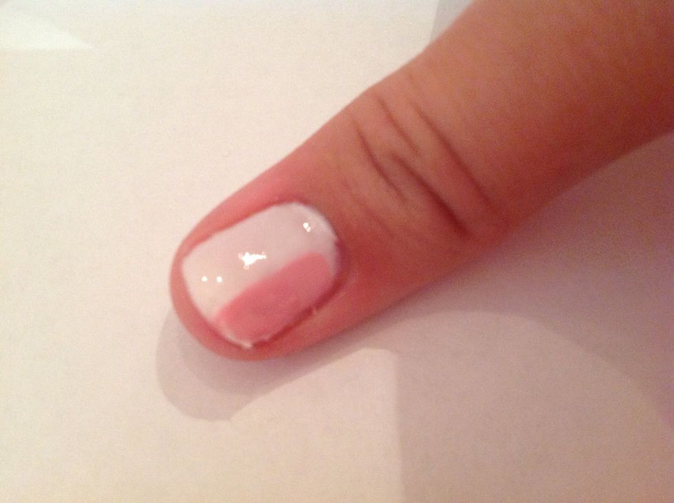 With your first colour, paint one stripe right down near to the edge of your nail, not covering the background. Make it roughly a third of your nail width.