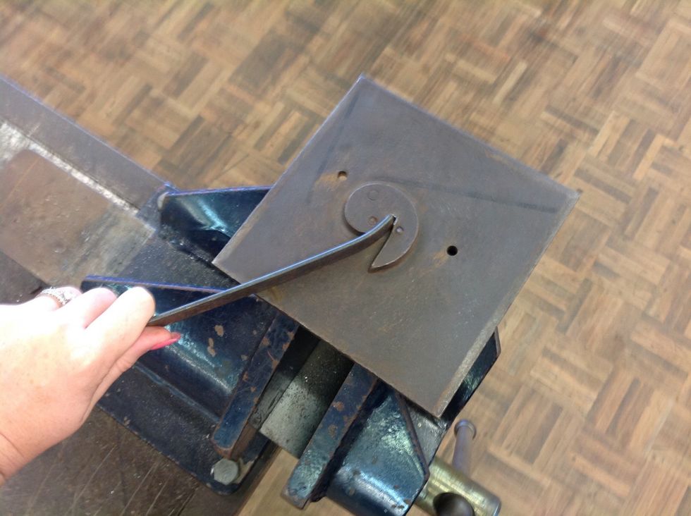 With your flat bar use the scroll template and bend the metal....