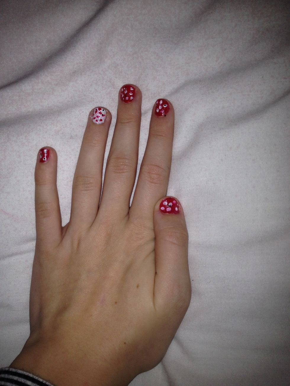 With your glitter nail polish, paint over the top of each nail to give it a Christmas sparkle!
