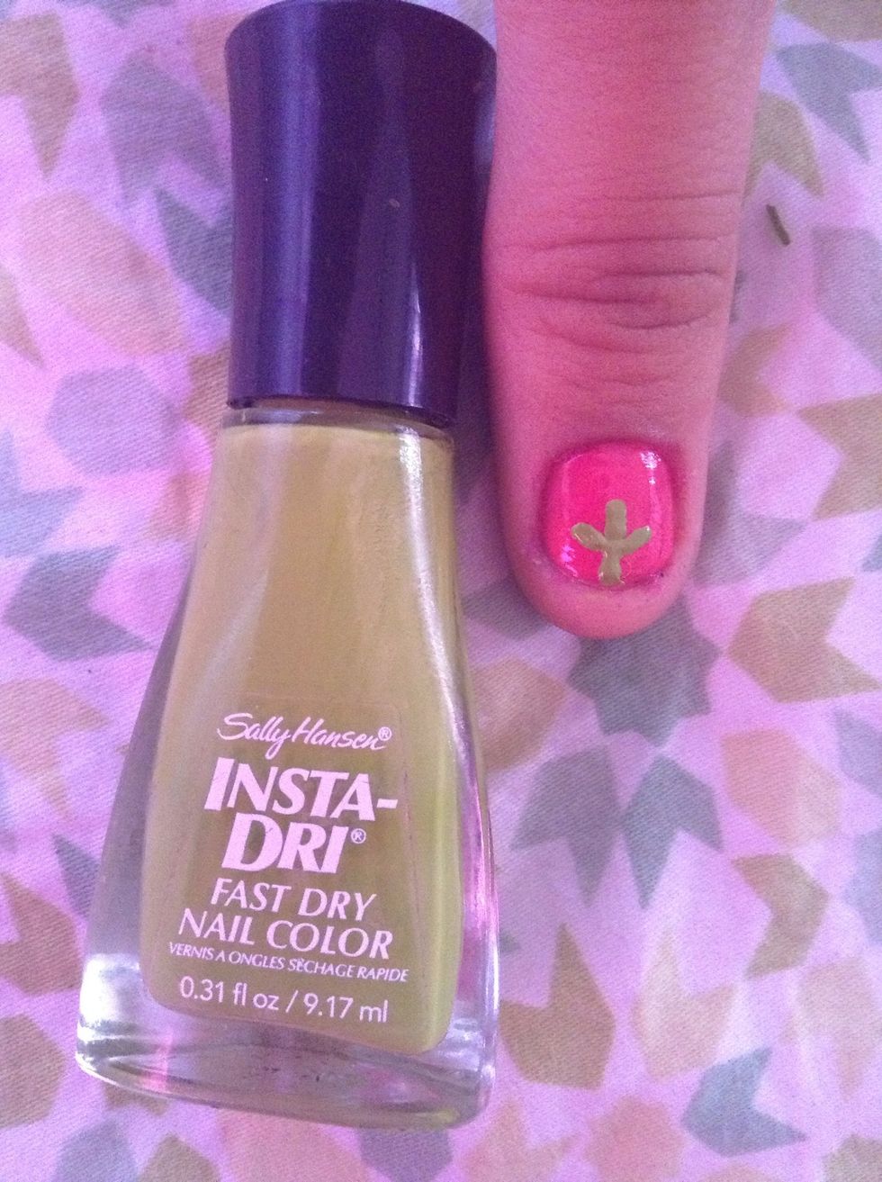 With your pin or dotting tool make a t sort of shape in the lower middle