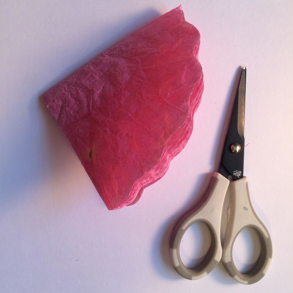 With your scissors, cut a scalloped edge. This is much easier to do while the filters are folded. Do this to the larger coffee filters as well