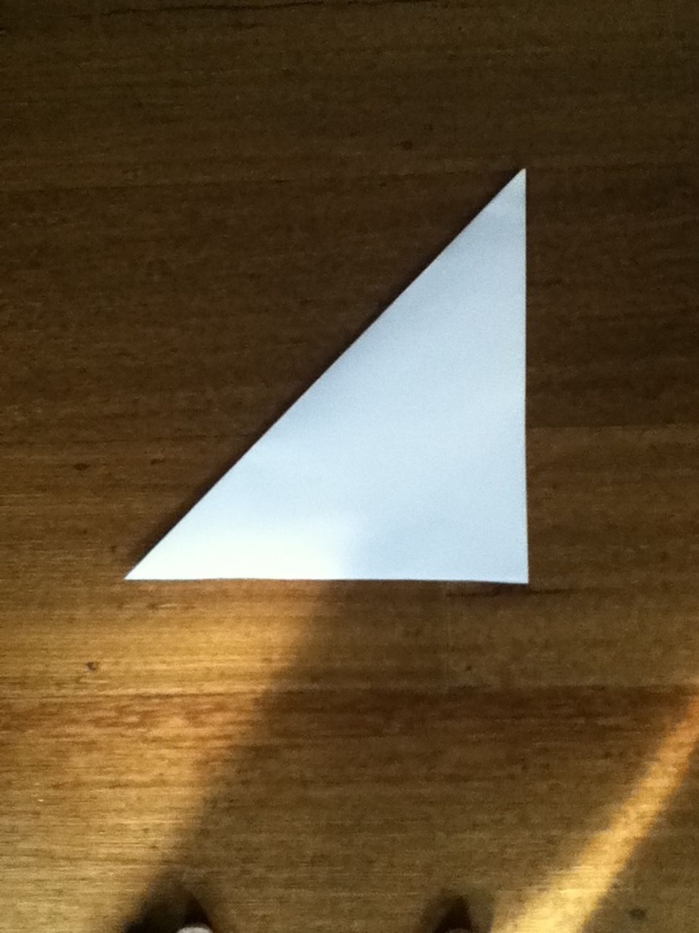 With your scissors cut off the part of paper you didn't fold over so now it looks like this...\u2b06