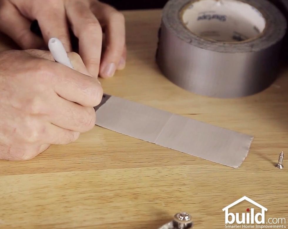 With your Sharpie, label the strip of duct tape.