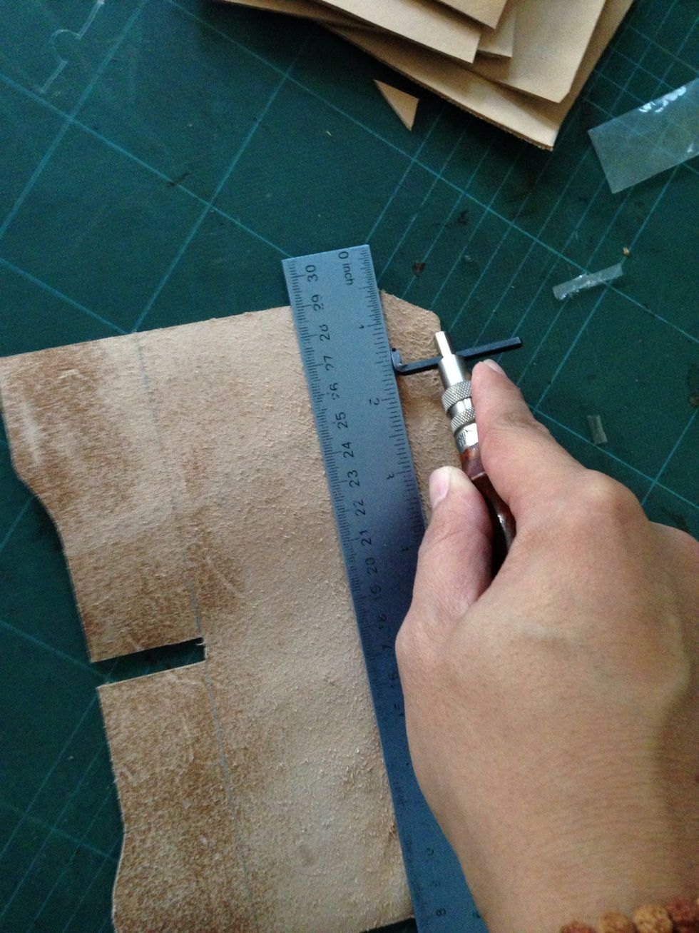 With your stitching groover skive the leather so it can be folded easily