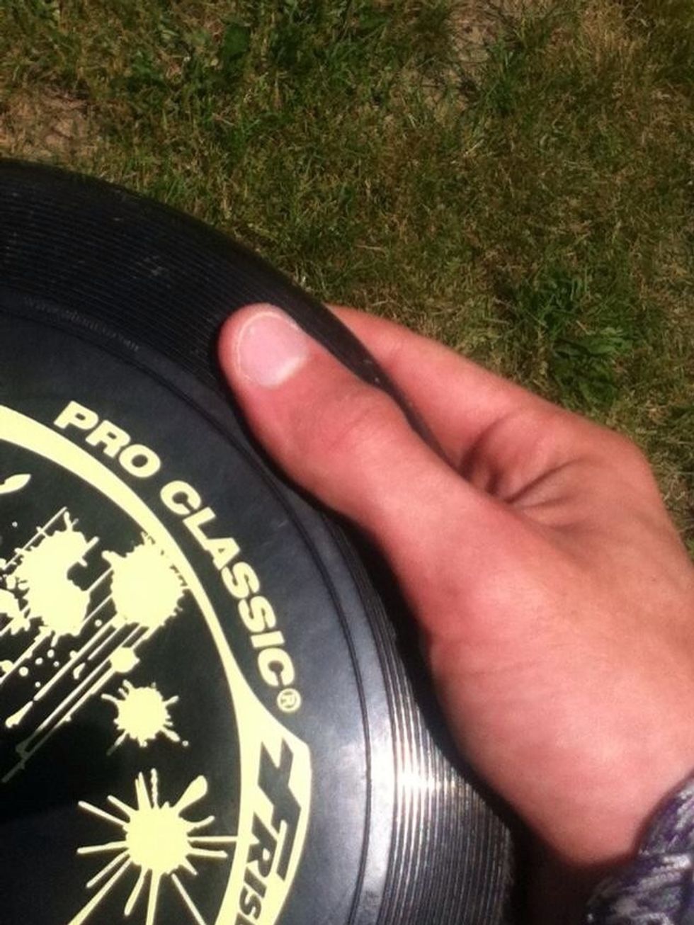 With your thumb in the ring.