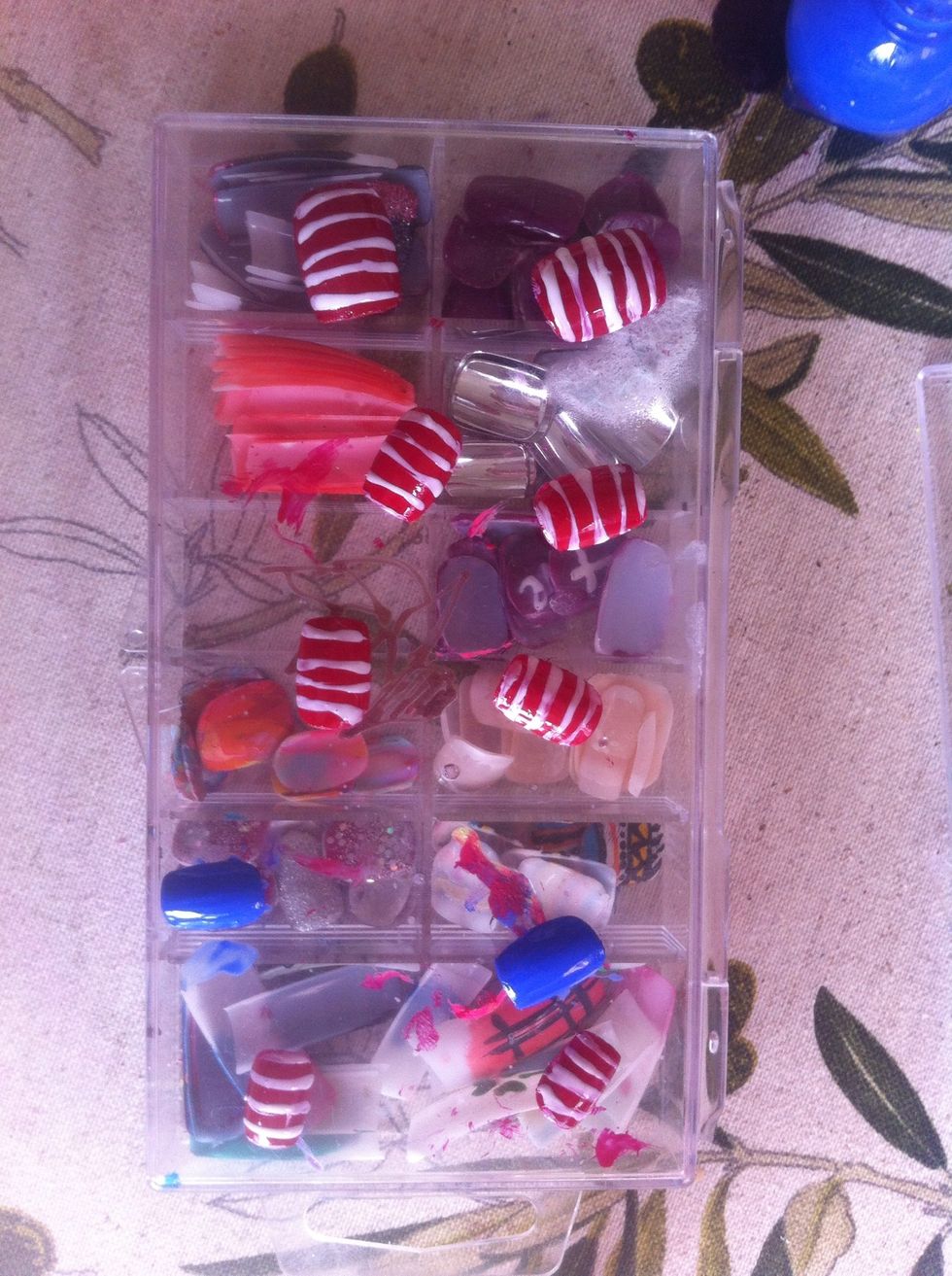 With your white striper/nail varnish, and lines vertically along all the red nails.