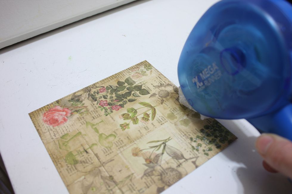 With your Xyron Tape runner- run a strip of adhesive right at the very edge of one side of your paper