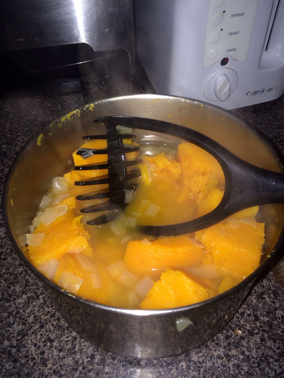 Without draining using a potato masher gently mash mixture.