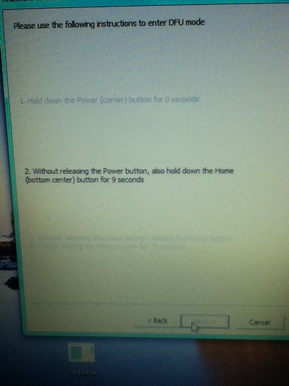 Without releasing the power button hold the home button for 9 seconds
