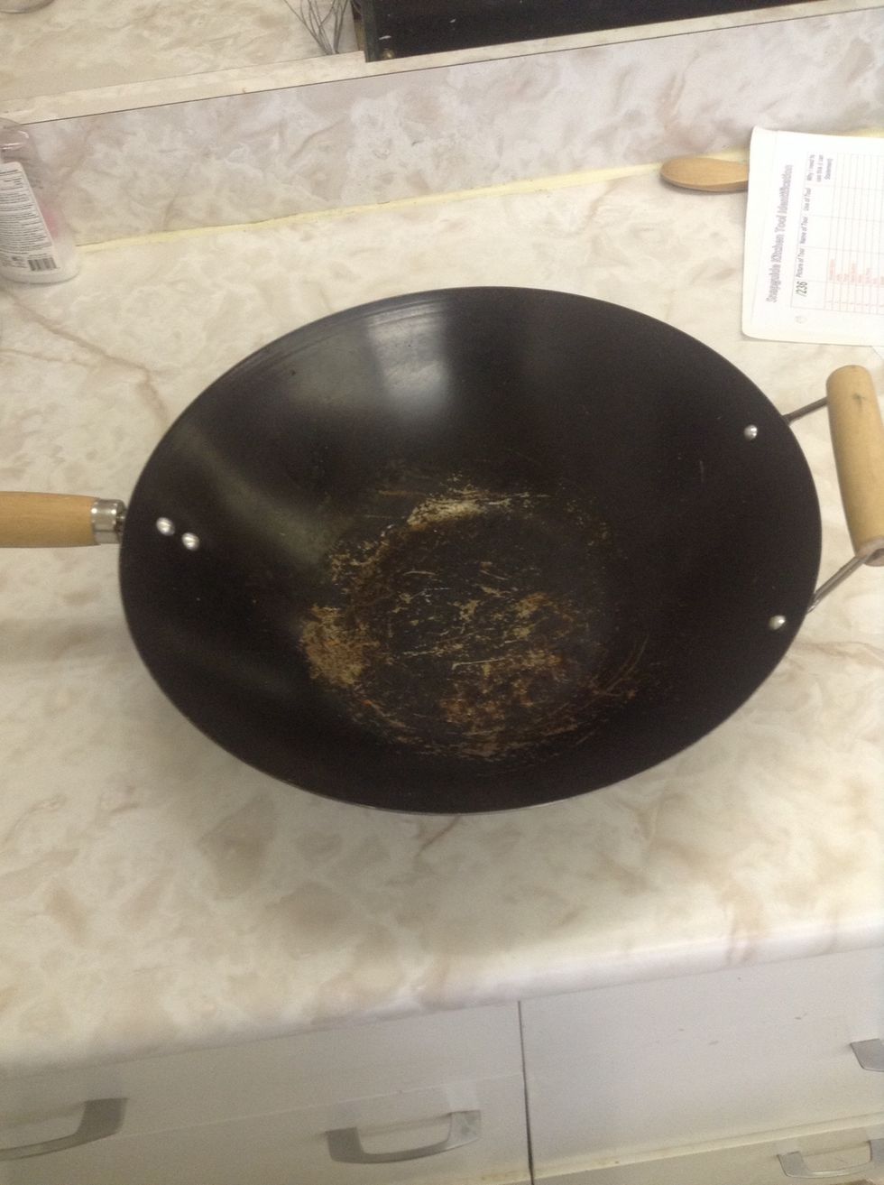 Wok. Used to cook things. I can use a wok to cook.