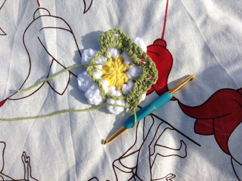 Work *3 dc in next loop, then work 3 dc, ch 2, 3 dc in next loop* and repeat this to the end. Join with a sl st to the 3rd ch of the ch-3.