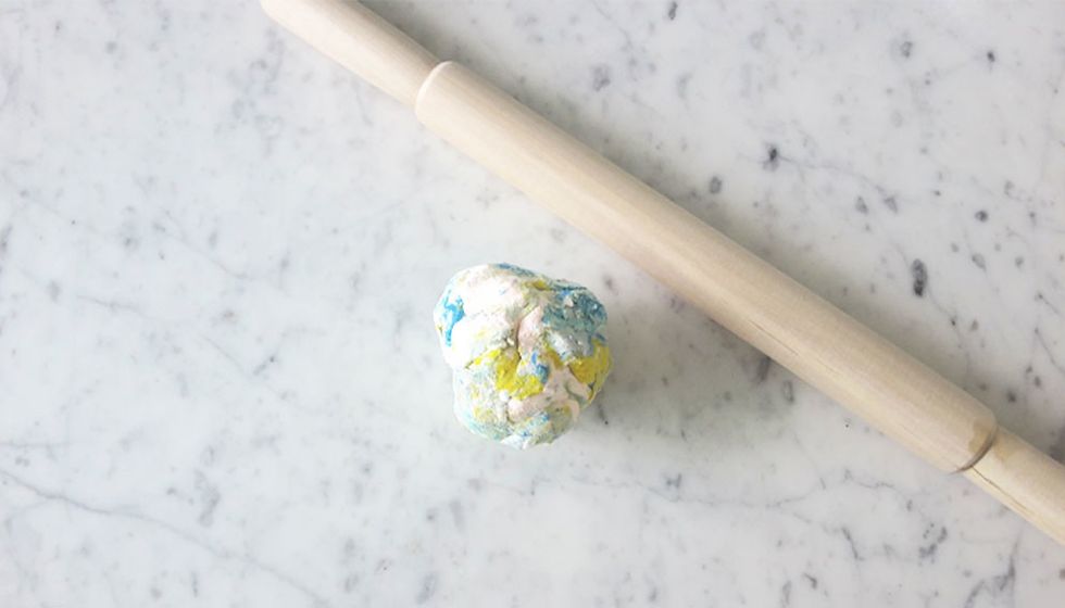 Work the clay in your hands and mix all together into a ball.